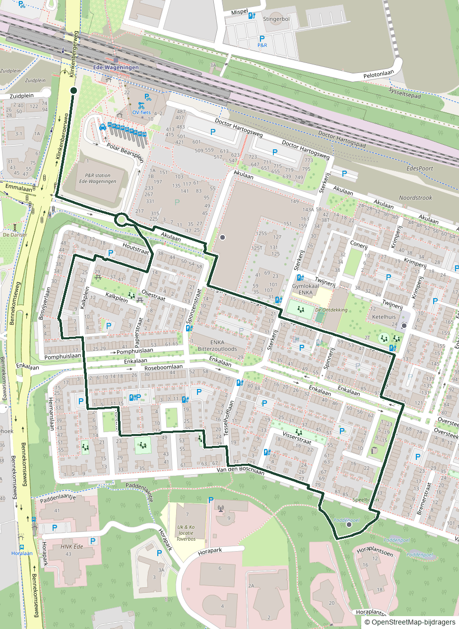 Kaart van het ENKA-rondje: een lus van 2,4 km vanaf station Ede-Wageningen over het ENKA-terrein, met markering van De Fietser, de Kleine Schoorsteen en de paddenpoelen